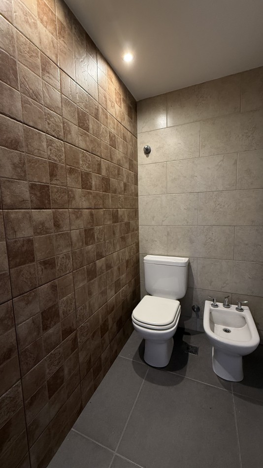 Departamento tres ambientes con cochera 